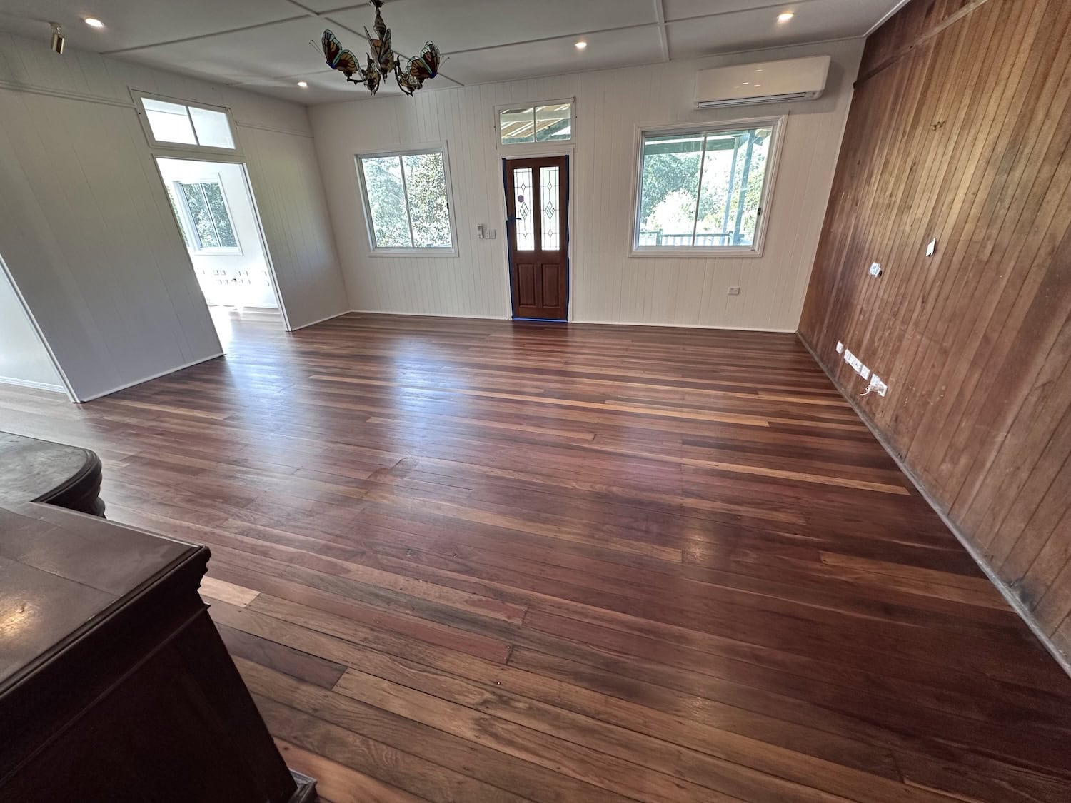 Hardwood flooring in a contemporary living space with large windows — Wilston floor sanding job
