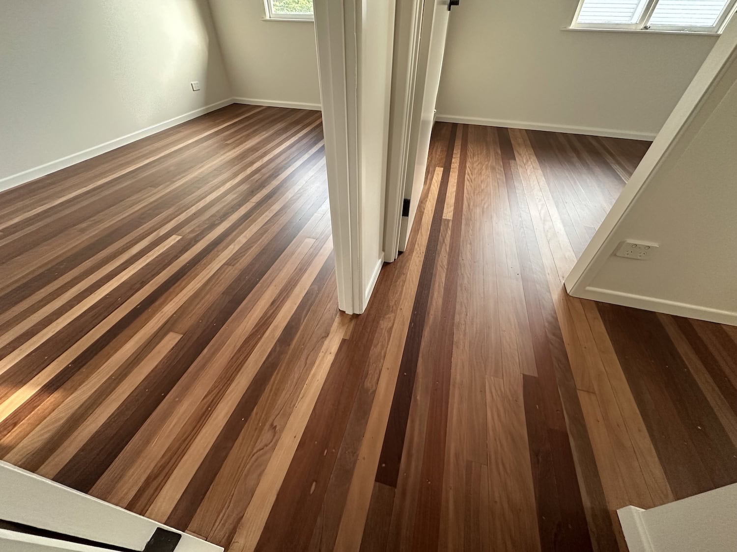 Wooden flooring installation in a modern home interior — example finish for Norman Park timber floors