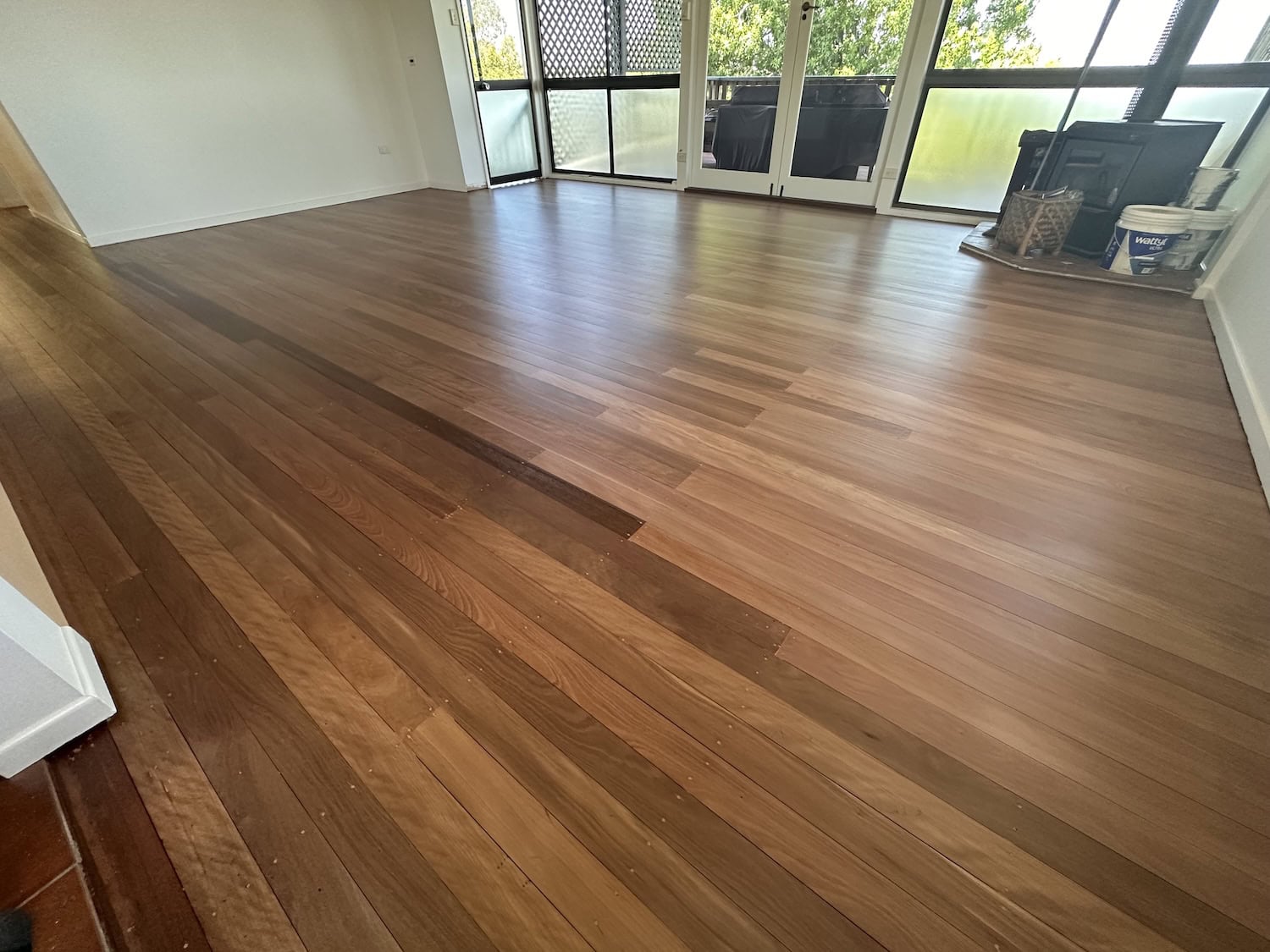 Beautiful hardwood flooring installed in a modern living room — example finish for Bardon timber floors
