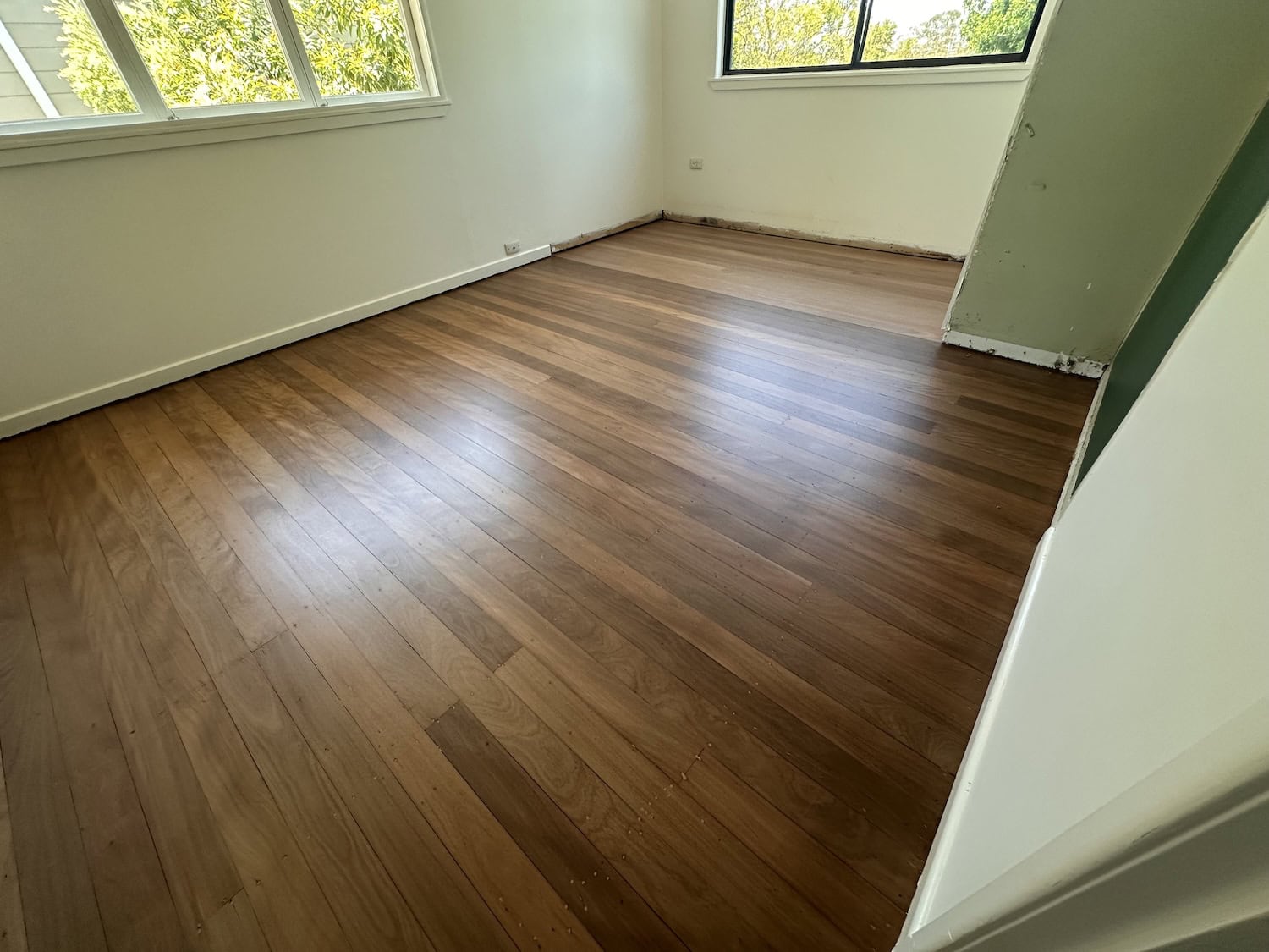 Modern hardwood flooring installation in a bright empty room — Norman Park floor sanding job