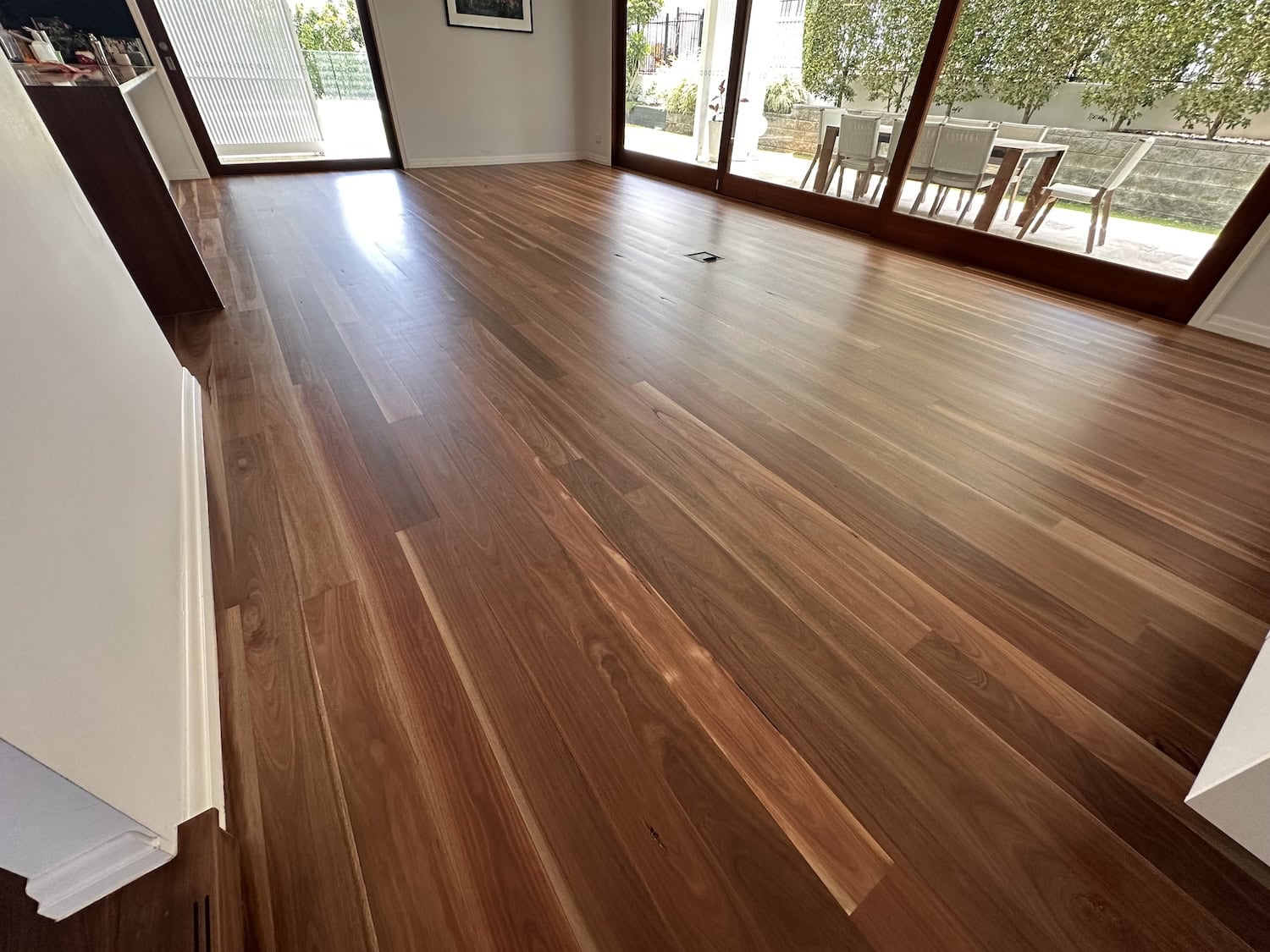 Wooden flooring installation in a modern living room — example finish for Hawthorne timber floors