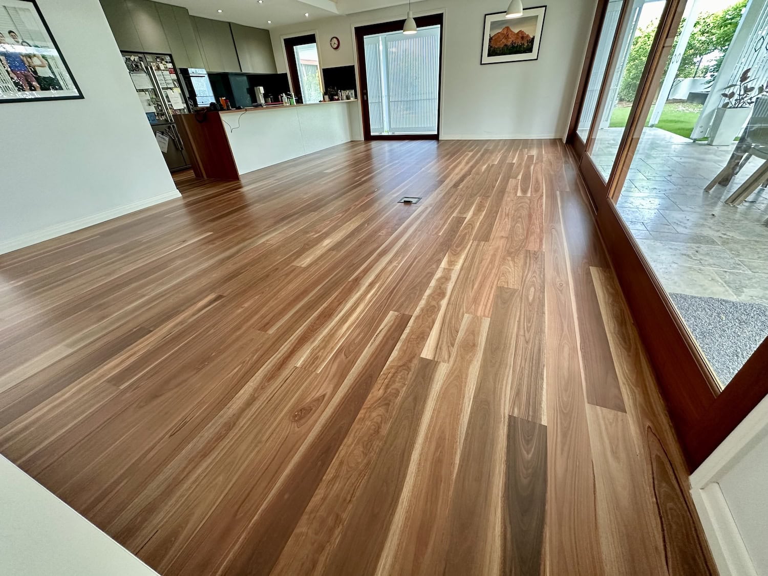 Wooden flooring in a modern living space with large windows and natural light in Kenmore Brisbane