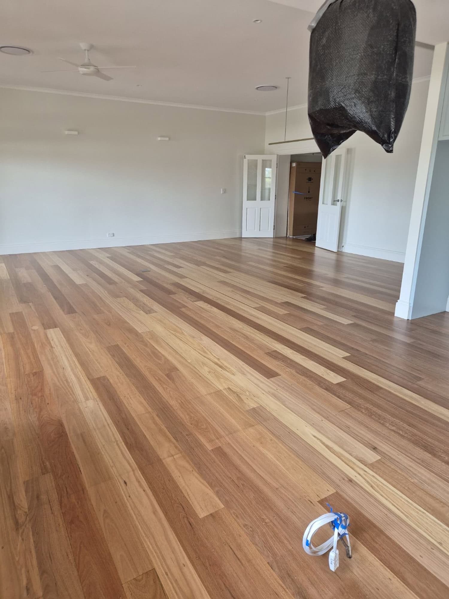Wooden flooring installation in a spacious living room in Bulimba Brisbane